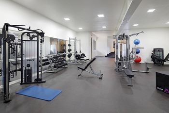 Fitness and strength training center with locker rooms